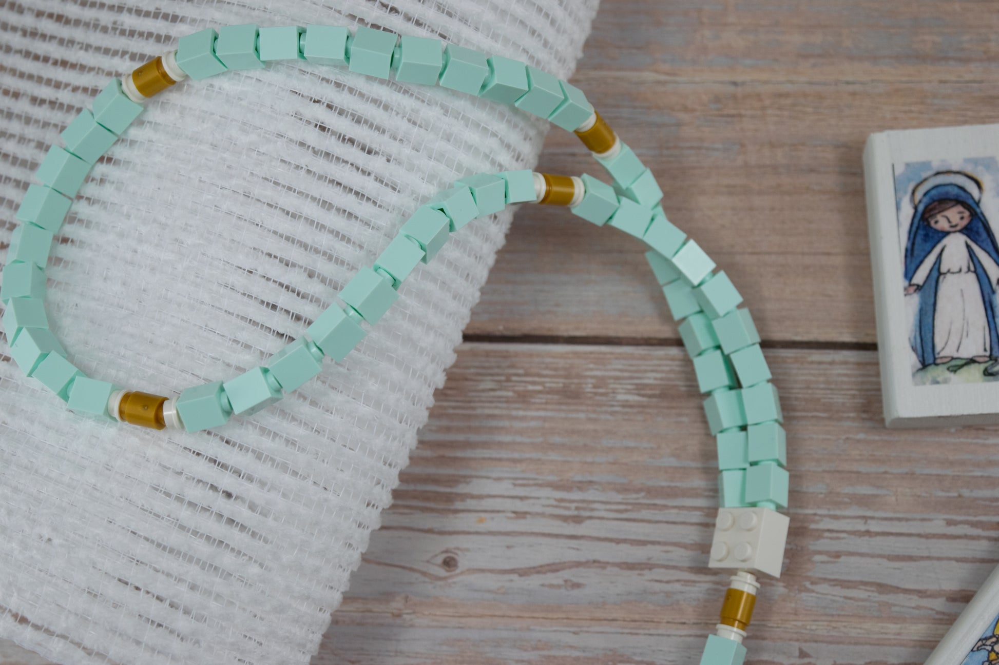 aqua blue white and gold lego rosary